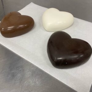 Small breakable milk chocolate heart with candy inside