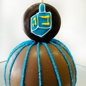 Milk chocolate caramel apple with decorated Oreo cookie topper
