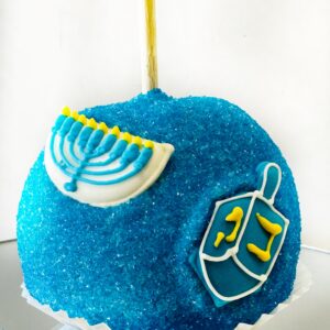 Blue caramel apple with decorated royal icing decorations