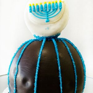 Dark chocolate caramel apple with decorated Oreo cookie topper